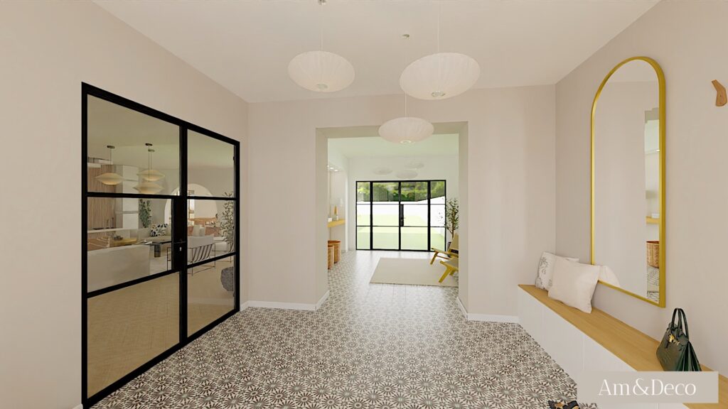 Entrée lumineuse aménagée par une décoratrice d'intérieur, avec carrelage à motifs, assise intégrée sous un miroir doré, et verrière en acier noir ouvrant sur un espace de vie chaleureux et moderne.