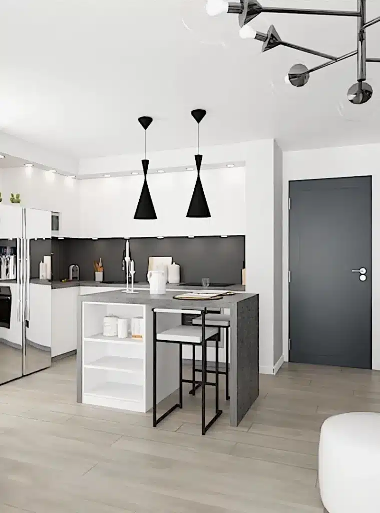 Cuisine moderne et lumineuse, aménagée après un conseil déco, avec un îlot central fonctionnel, des luminaires suspendus design, des placards blancs épurés et un revêtement mural en contraste. ​​







