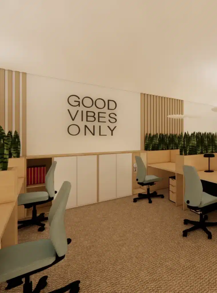 Aménagement d'un espace de travail collaboratif avec des bureaux en bois clair, des chaises ergonomiques, et des éléments décoratifs naturels pour un environnement de travail agréable.