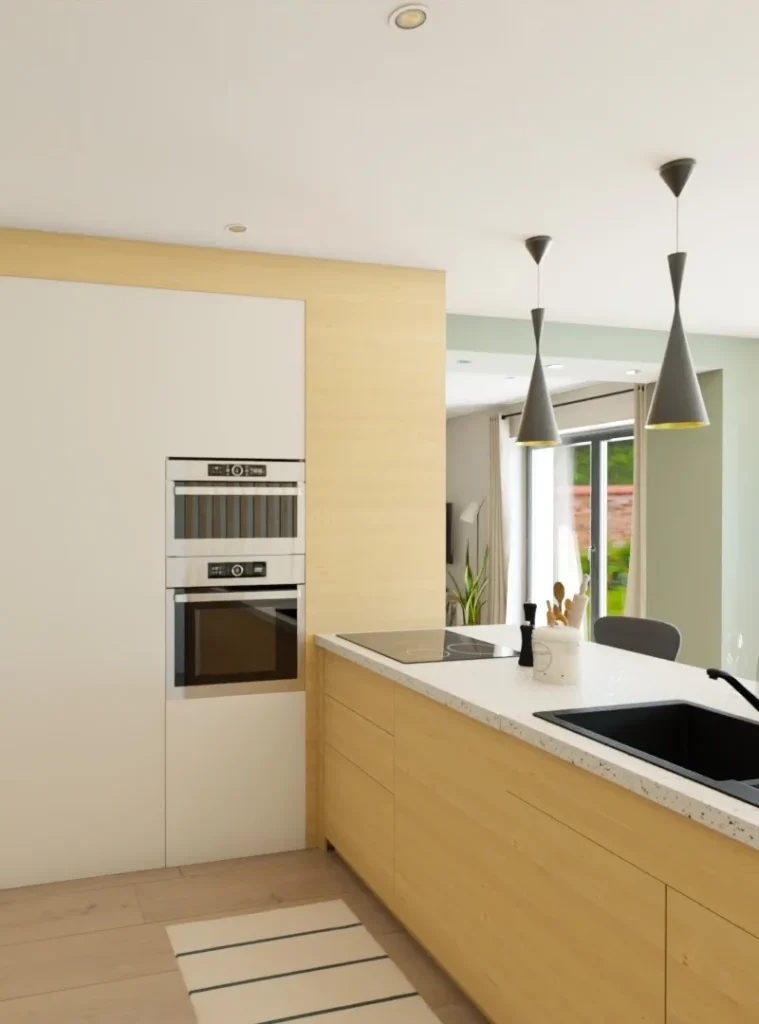 Cuisine moderne avec îlot central et luminaires suspendus, dans un projet de home staging visant à valoriser un bien immobilier.
