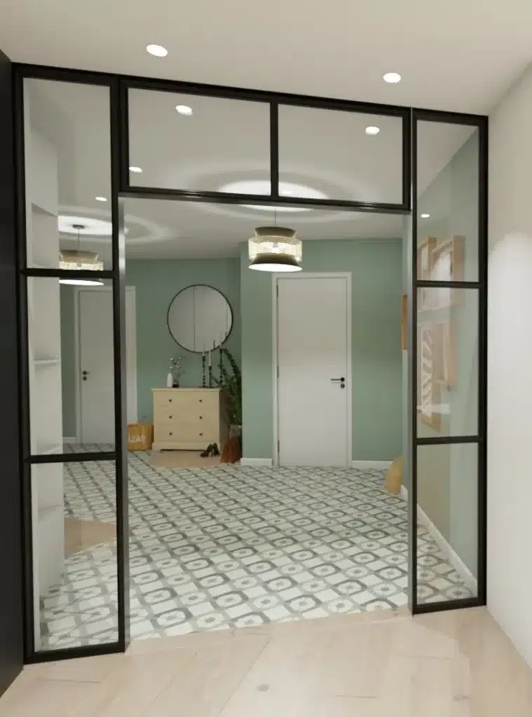 Entrée élégante avec verrière, sol en carreaux de ciment et miroir décoratif, conçue pour améliorer l'attrait d'un intérieur en vue d'une vente.
